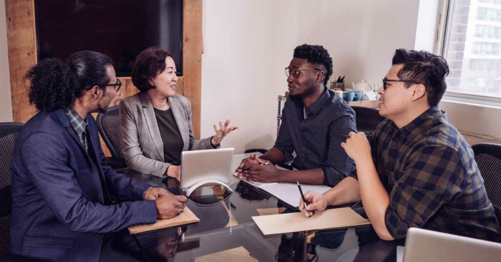 A professional woman giving financial advice and tips on how to get cheap loans to young men