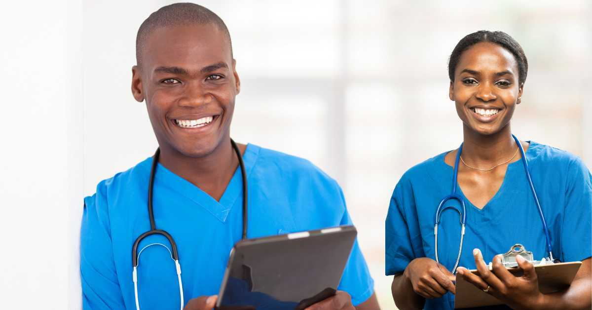 A male and female doctor standing next to each other smiling